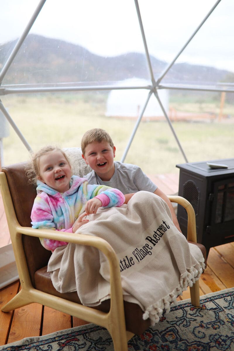 Young Children laughing while glamping at Little Village Retreat near Zion National Park Utah